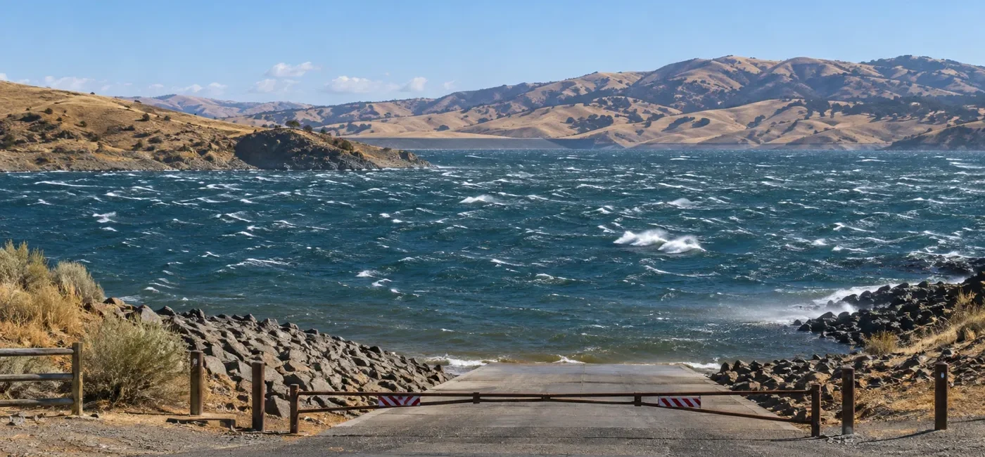 Wind-driven rough water at San Luis Reservoir and a safely closed boat launch