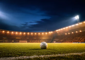 Night stadium illustration evoking Lens versus PSG in the 2026 Trophee des Champions